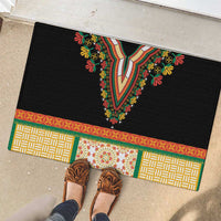 Black rubber doormat with colorful neckline embroidery, geometric panels, and floral band