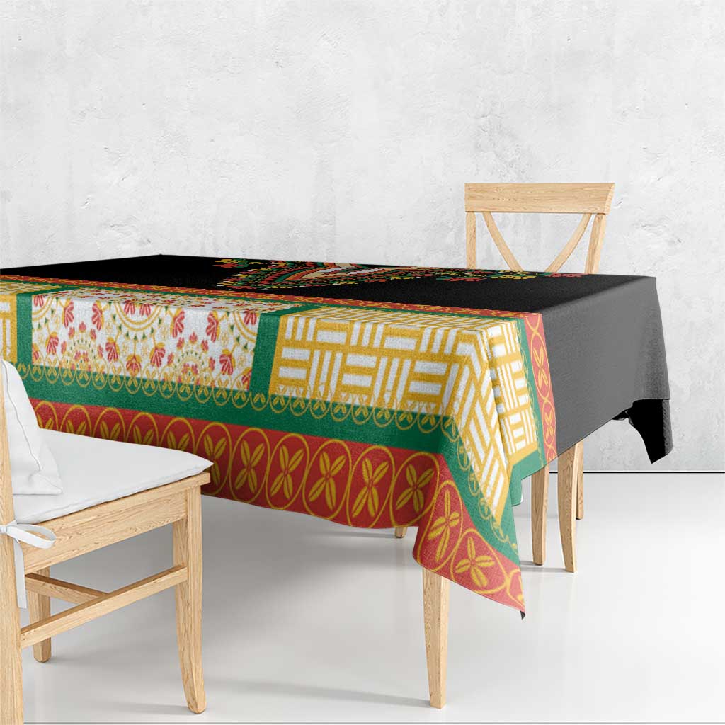 Black tablecloth with multicolor geometric and floral pattern, draped over table