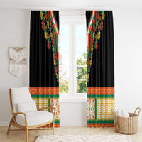 Black embroidered curtain panels with colorful patterned band at the bottom hem