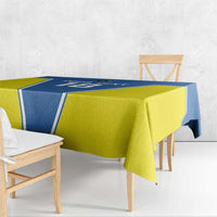 Blue and yellow tablecloth with border trim, draped over table and chairs