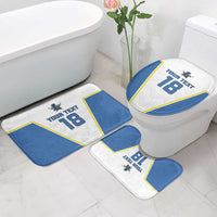 Blue and white bath mat set with yellow trim around a toilet, custom text 18