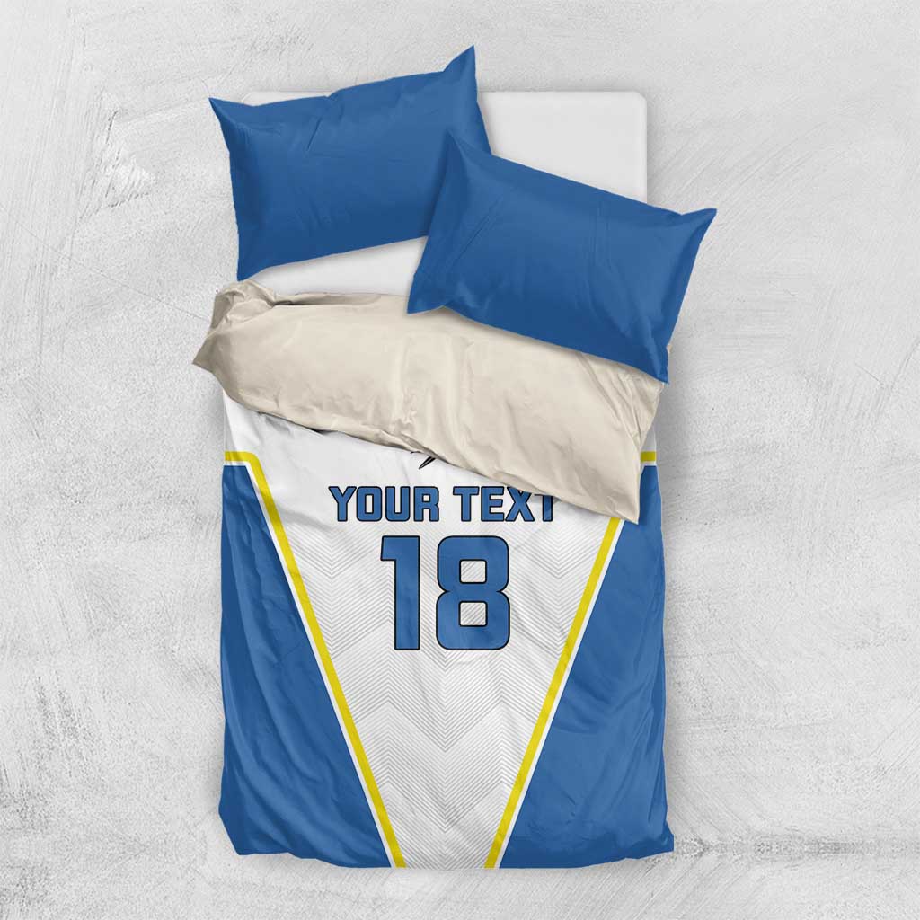 Blue-and-white bedding set with two pillows; “YOUR TEXT” and number 18 center print