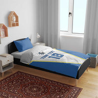 Blue-and-white custom duvet set with pillows; “YOUR TEXT” and number 18 graphic
