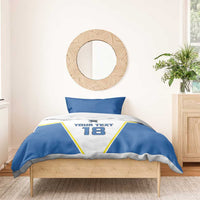 Blue-and-white bedding set with pillows; “YOUR TEXT” and number 18 on duvet front