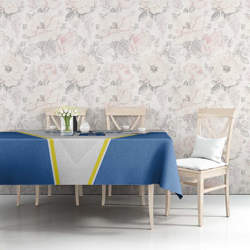 Blue and white tablecloth spread across dining table with central '18' design