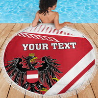 Red-and-white round beach blanket with fringe, “Your Text” and black coat of arms
