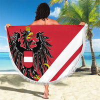 Red-and-white round beach blanket with fringe, diagonal stripes, black coat of arms, “Your Text”