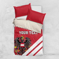 Red and white comforter set with 'YOUR TEXT' and coat of arms emblem on quilt top