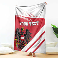 Personalized flag-style blanket with red/white stripes, black crest, and 'YOUR TEXT'