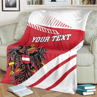 Flag-style throw blanket with red center, white diagonal stripes, black crest, and 'YOUR TEXT'