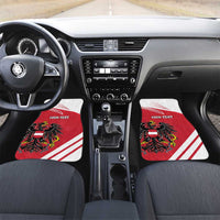 Red car floor mats with white stripes, Austria coat of arms, and 'YOUR TEXT' on each.