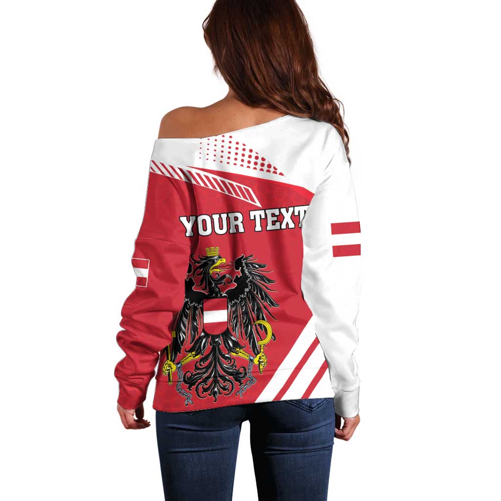 Women’s off-shoulder sweater with red/white flag print and crest, back view