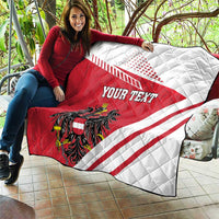 Red and white quilt flag blanket with Austrian crest, diagonal stripes, and 'YOUR TEXT' draped
