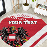 Red round carpet with YOUR TEXT lettering and black eagle crest graphic