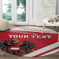 Red round carpet with custom text and black eagle coat of arms design