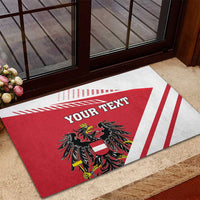 Personalized Austria coat of arms doormat in red and white with 'YOUR TEXT'.