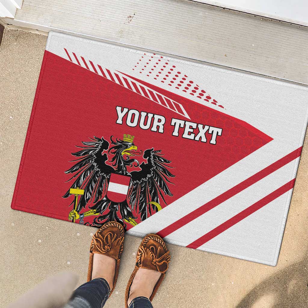 Red and white Austria coat of arms doormat with 'YOUR TEXT' and diagonal stripe design.