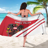 Red and white flag sarong draped with “YOUR TEXT” and black crest
