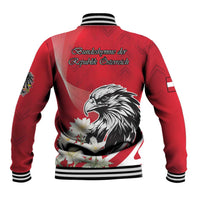 Red baseball jacket back with eagle and white floral graphic, striped ribbed trim