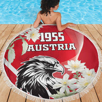 Round red beach blanket showing 1955 Austria, eagle and white flowers, fringed edge
