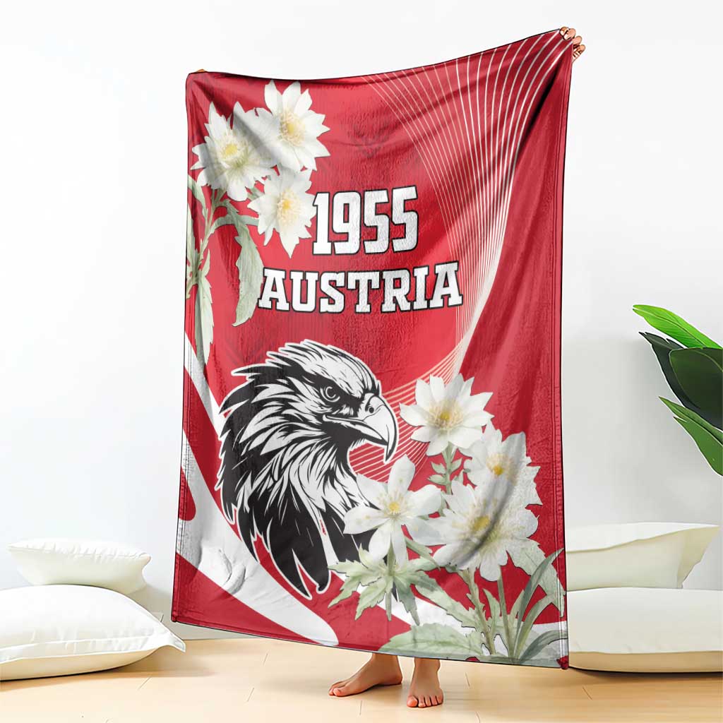 Red Austria blanket draped on floor with black eagle, white flowers, and “1955”