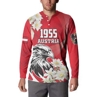 Red button sweatshirt worn by model, 1955 Austria eagle and white flower print