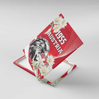 Square red canvas wall art showing "1955 AUSTRIA" eagle with white flowers