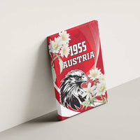 Red canvas wall art on wall: black eagle, white flowers, "1955 AUSTRIA" design