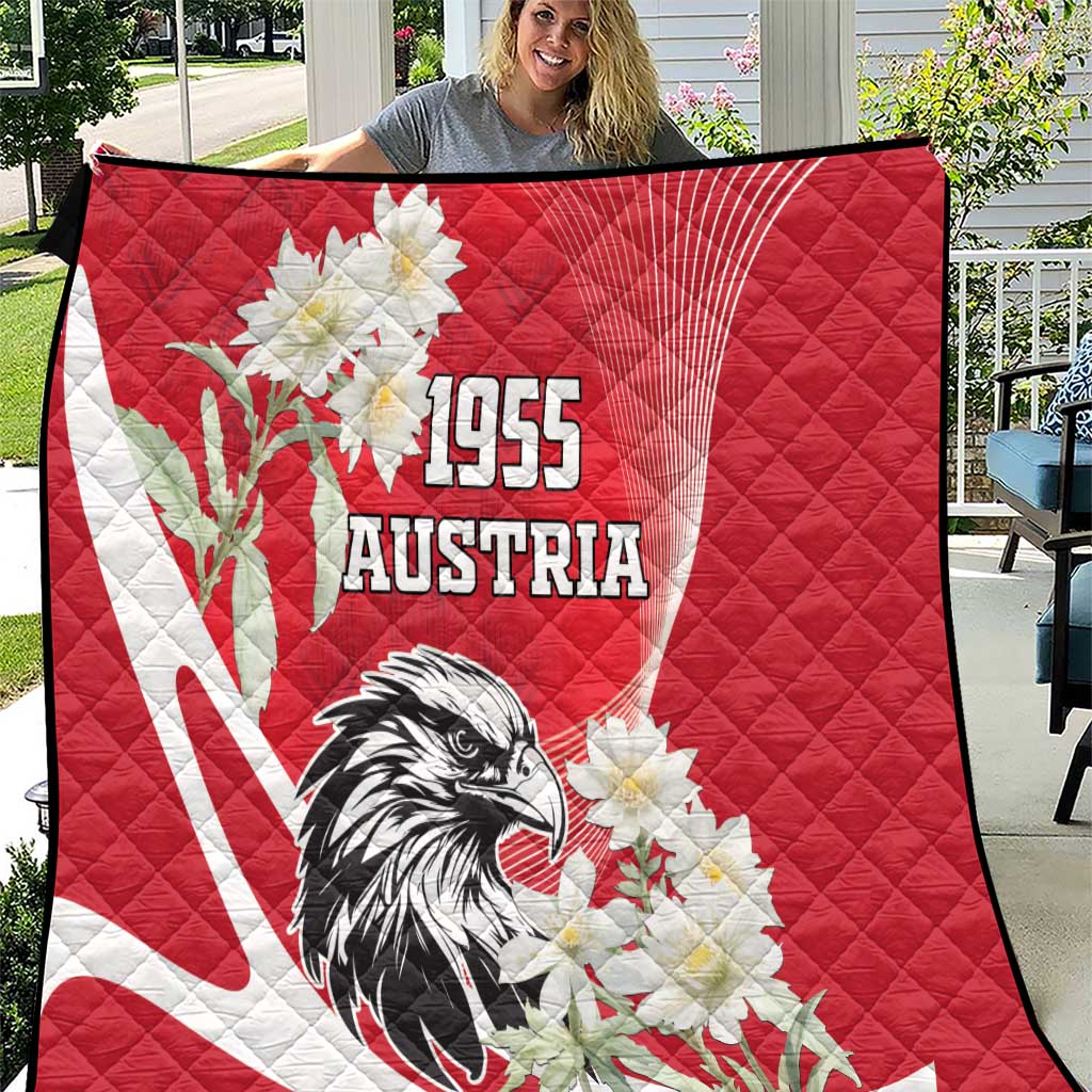 Red quilt with white edelweiss flowers, Austrian eagle, and 1955 text graphic
