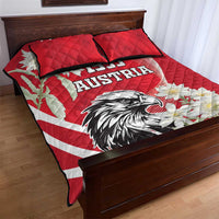 Red quilt bed set with 1955 Austria eagle, white stripe flag, and floral accents; two pillows