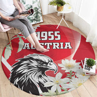 Round red Austria 1955 rug with black eagle face and white daisy-style flowers