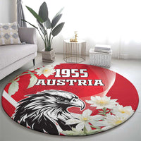 Round red Austria 1955 carpet with eagle and white blossoms, bold 1955 Austria lettering
