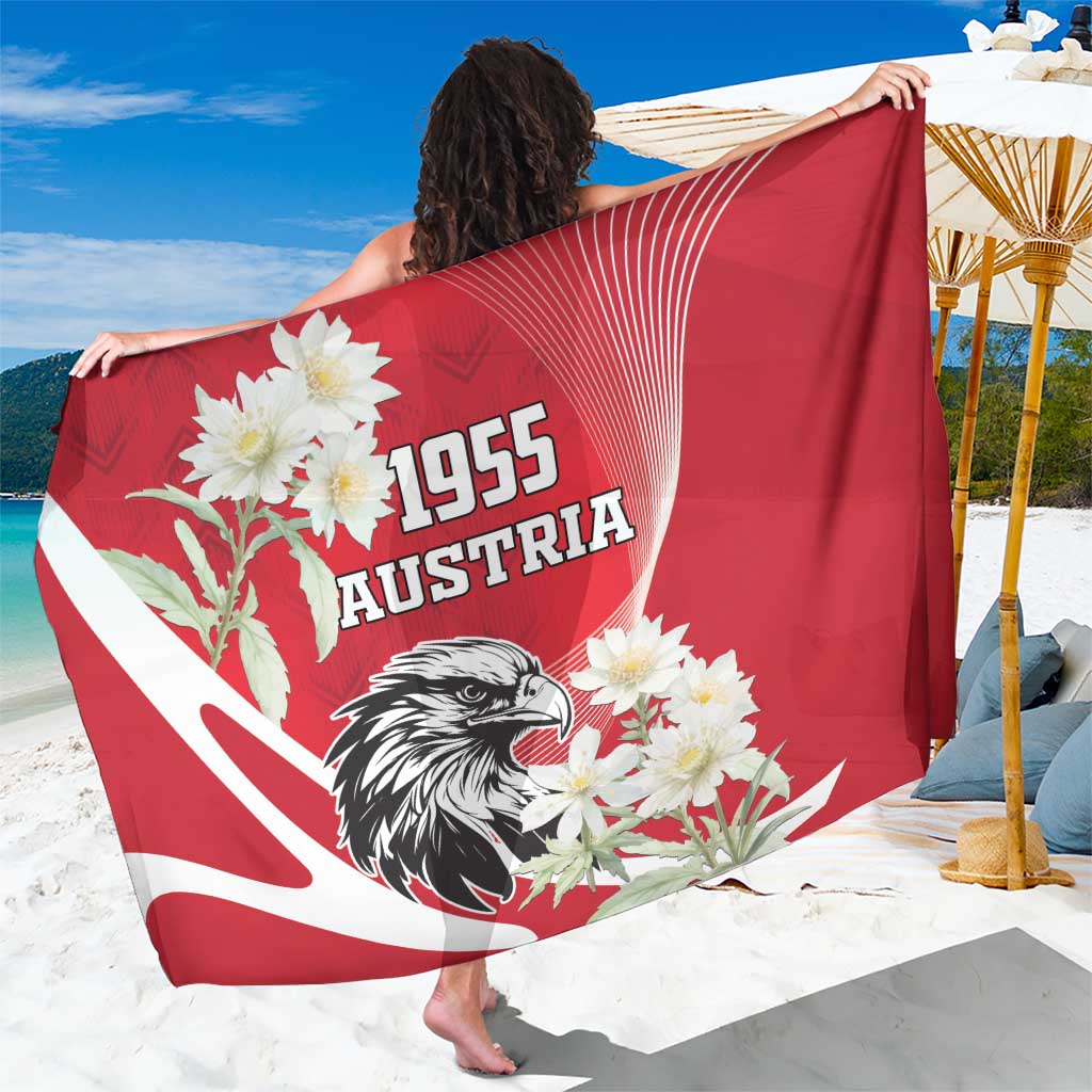 Red sarong with 1955 Austria text, white eagle, and flower print