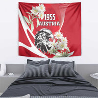 Hanging red tapestry featuring Austria 1955 text, eagle portrait, and white flowers