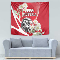 Red Austria 1955 tapestry showing eagle head, white edelweiss flowers, and arc rays