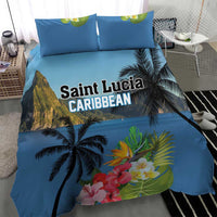 Blue duvet cover and pillow shams featuring palm tree silhouettes and tropical flowers
