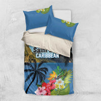 Blue duvet cover set with two pillow shams, palm trees, and colorful hibiscus flowers
