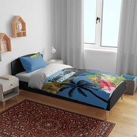 Blue bedding set on bed: duvet cover and pillow shams with tropical palms and flowers