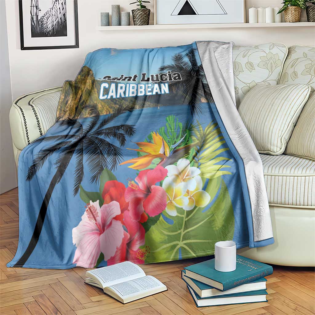 Blue tropical blanket with hibiscus flowers, palm trees, and 'Saint Lucia Caribbean' text