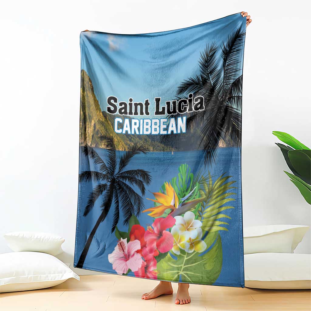 Blue tropical blanket draped over chair with palm trees and hibiscus flower print