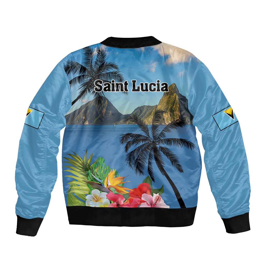 Blue bomber jacket back view with palm trees and hibiscus floral print, black ribbed hem