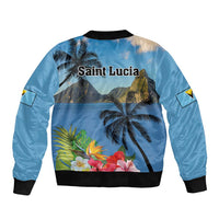 Blue bomber jacket back view with palm trees and hibiscus floral print, black ribbed hem