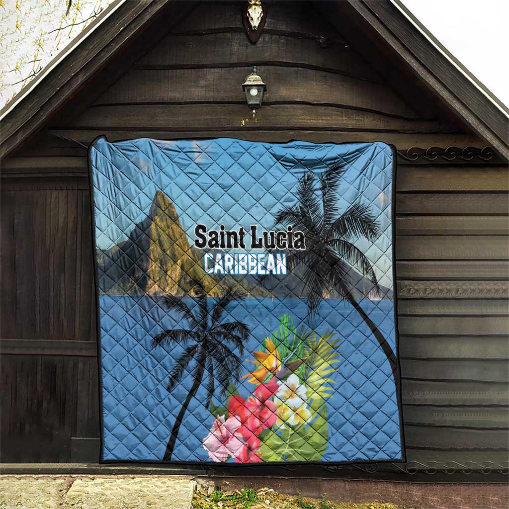 Blue quilt hanging on wooden wall with palm trees, hibiscus flowers, and 'Saint Lucia Caribbean' text