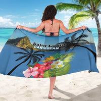 Blue sarong with hibiscus flowers and tropical palm-leaf print, worn as beach wrap