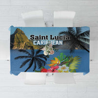 Blue tablecloth with tropical hibiscus and palm leaves design, centered on a table