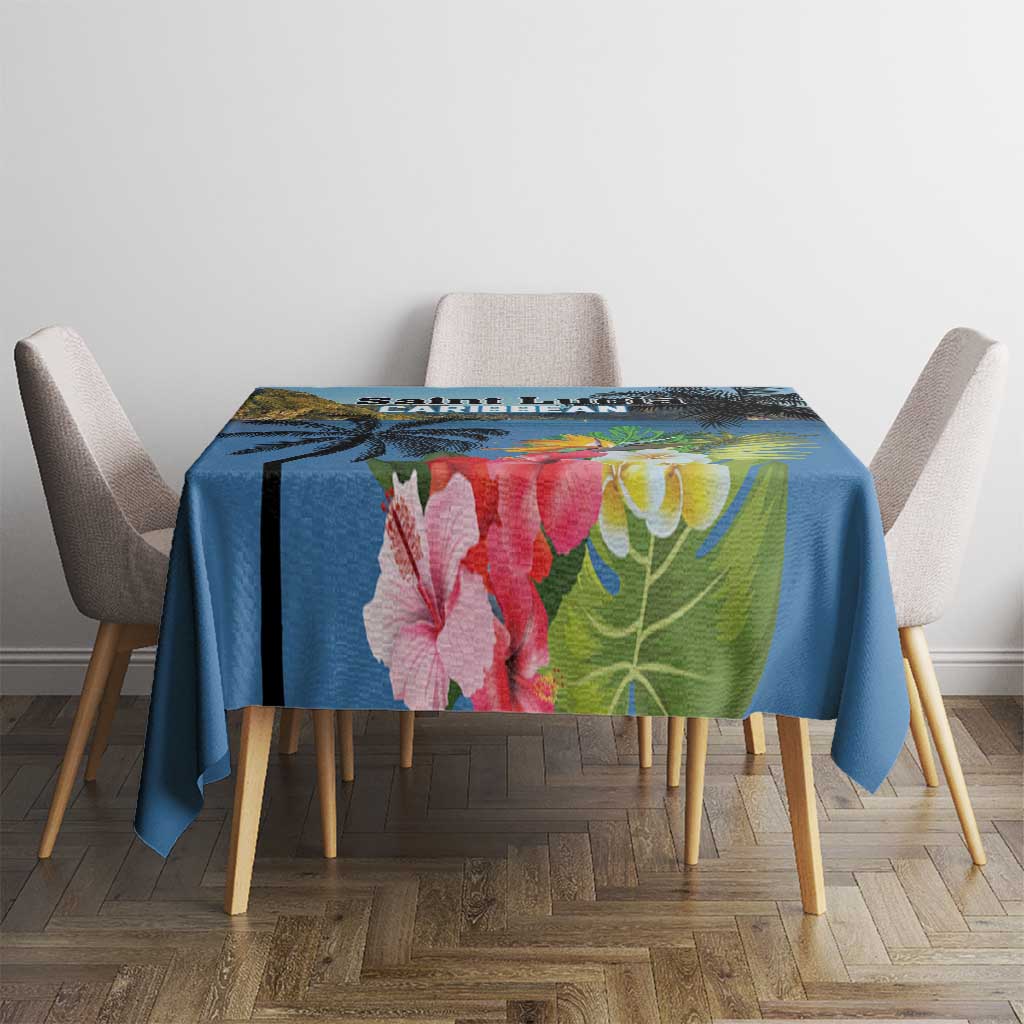 Blue tropical tablecloth with hibiscus blossoms and green foliage on dining table