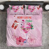 Pink Christmas bedding set showing 'MERRY FLOCKING' with flamingo cocktail on duvet