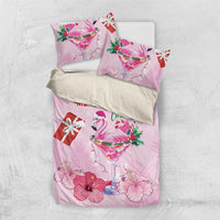 Pink Christmas bedding set with flamingo cocktail, gift box, holly leaves, and flowers