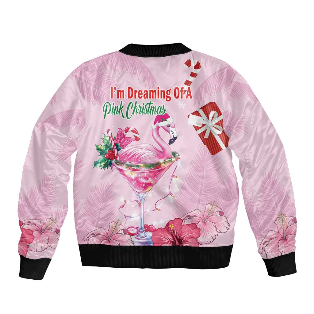 Pink unisex bomber jacket with black ribbed trim and flamingo holiday print