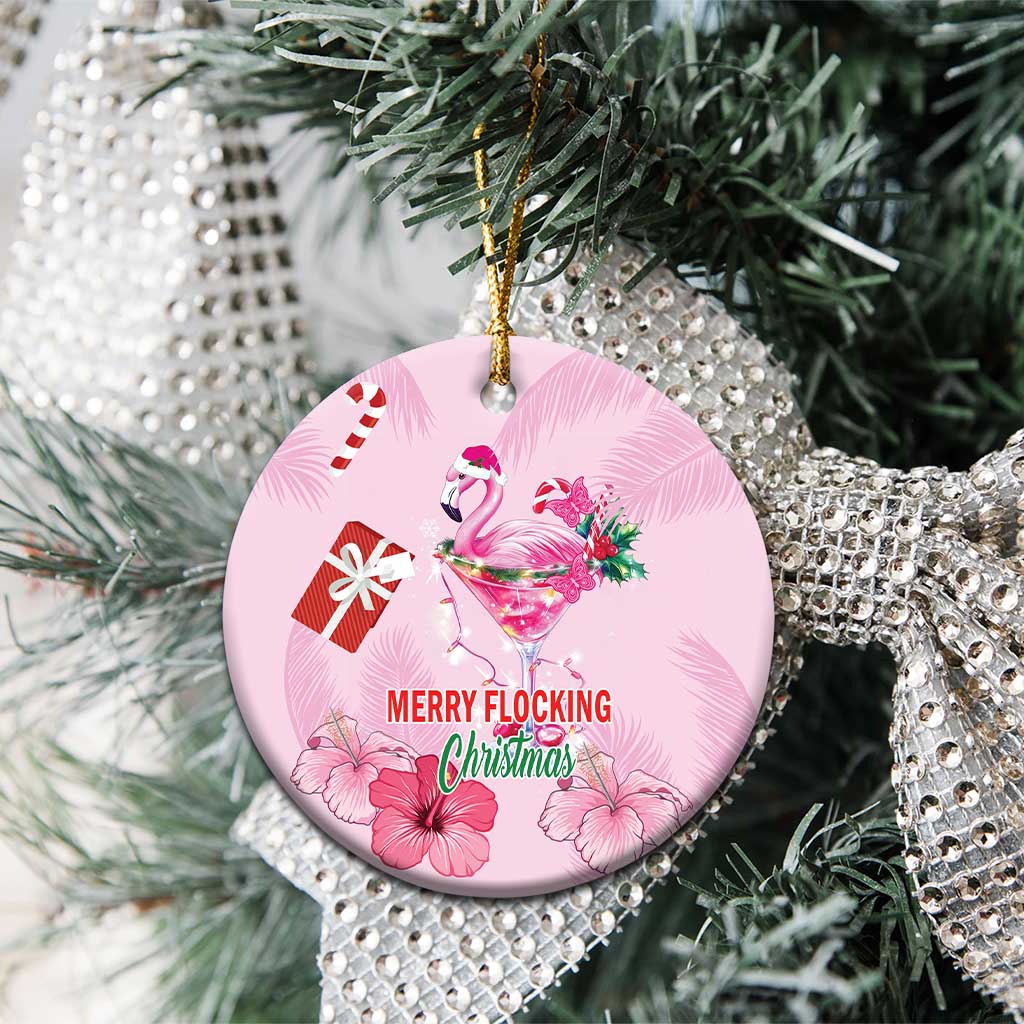Pink round flamingo Merry Flocking Christmas ceramic ornament with gold hanging loop.